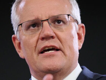 CANBERRA, AUSTRALIA - FEBRUARY 01: Prime Minister Scott Morrison arrives to anti-vaccine protestors at the National Press Club. February 01, 2022 in Canberra, Australia. (Photo by Rohan Thomson/Getty Images)