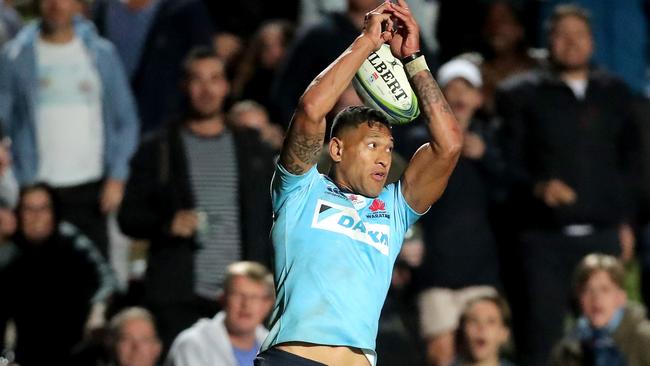 Israel Folau of the Waratahs misses a catch at Brookvale Oval in Sydney.