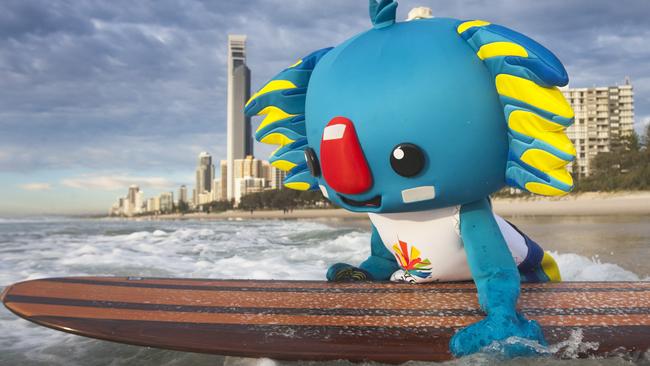 Borobi, the Gold Coast Commonwealth Games mascot, hits the water at Surfers Paradise for an early morning surf. Picture Glenn Hampson