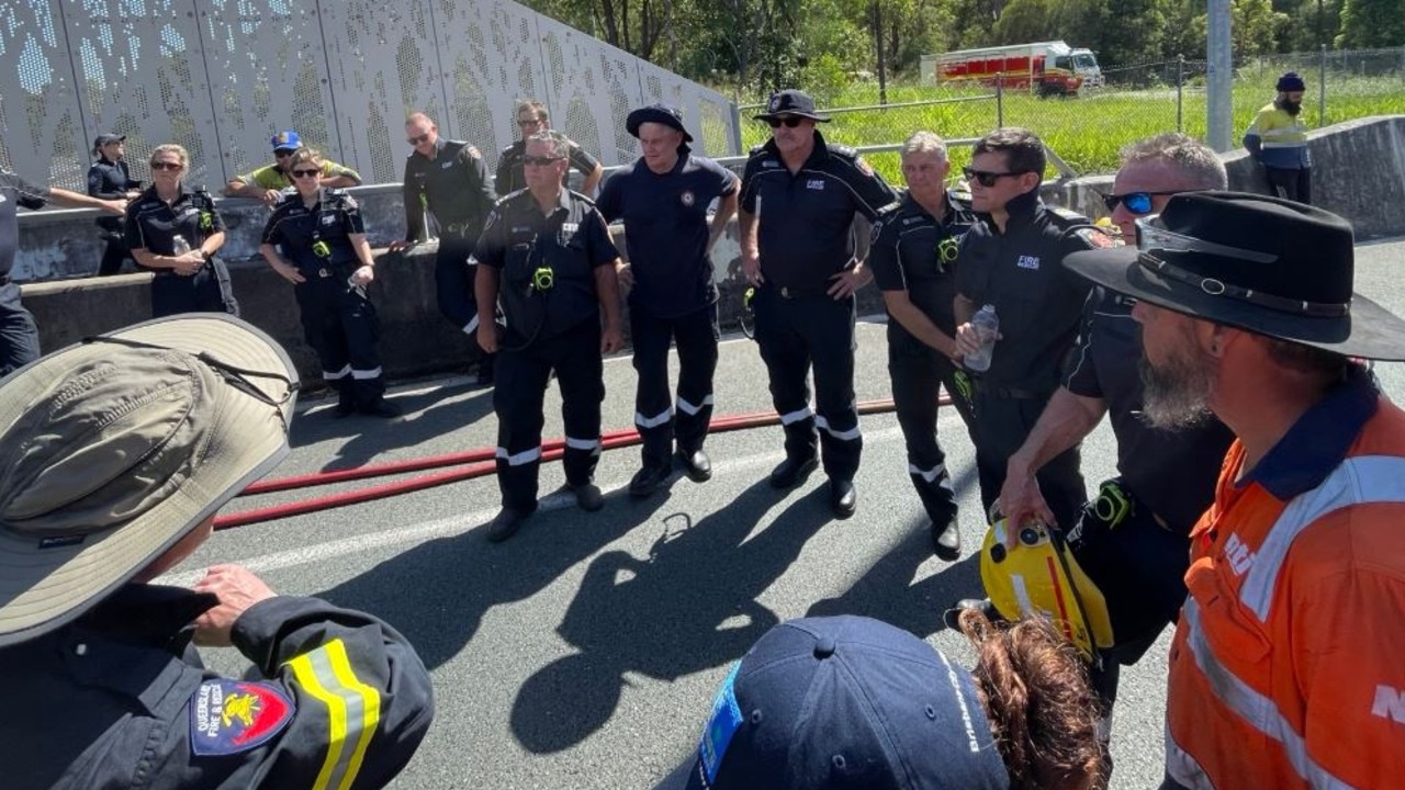 Emergency crews on the scene of a chemical spill caused by a truck trailer overturning south of Brisbane. Picture: Queensland Fire Department