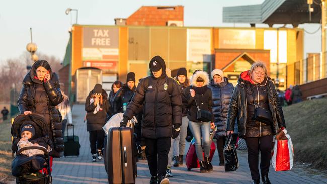 People are seen after they crossed the Polish-Ukrainian border at Medyka. Picture: AFP