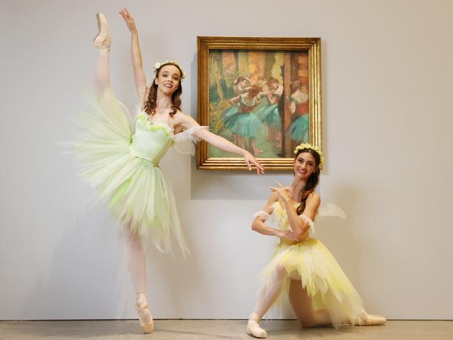 Laura Tosar and Chiara Gonzalez with the 19th century Edgar Degas painting 'Dancers, Pink and Green'. Picture: Lachie Millard