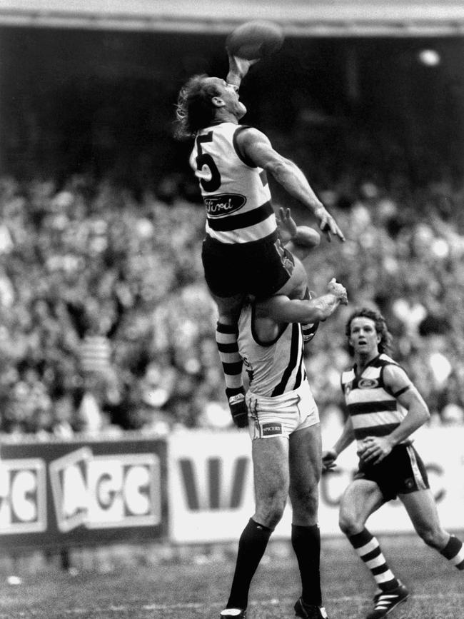 Gary Ablett sits on Gary Pert’s shoulders.