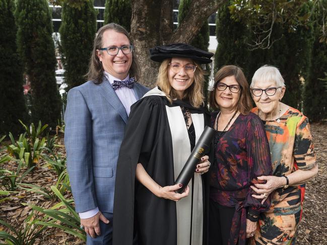 Doctorate of Creative Arts graduate Tara East with (from left) Ashley Dean, Bev Miller and Pearl Rognoni at a UniSQ graduation ceremony at Empire Theatres, Tuesday, February 13, 2024. Picture: Kevin Farmer