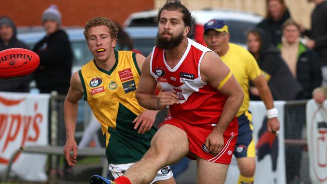 NFNL: Moussa Ali gets a kick for Lalor. Picture: Hamish Blair