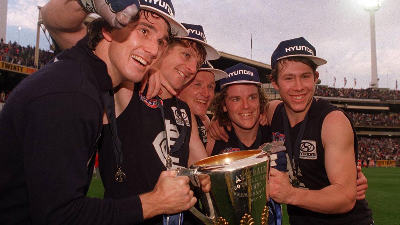 Ratten (right) says he received amazing support from premiership teammates Craig Bradley (centre) and Fraser Brown (second right).