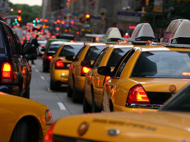 Busy streets of NYC are marked with yellow cabs. Jump in and out without parking problem.