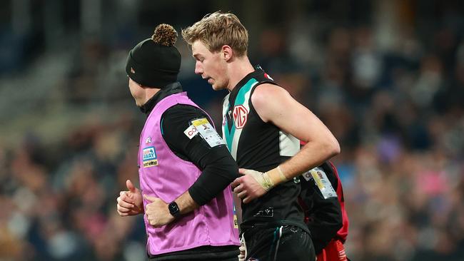 Marshall jogged off the ground and was cleared of concussion. Picture: Kelly Defina/Getty Images