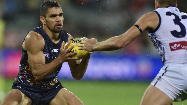 Charlie Cameron beats Docker Stephen Hill to the ball at Adelaide Oval. Picture: David Mariuz (AAP)