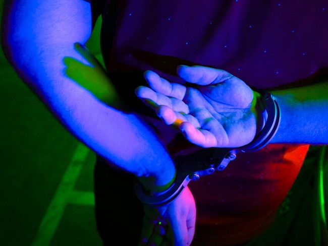 Cairns police generic handcuffs night