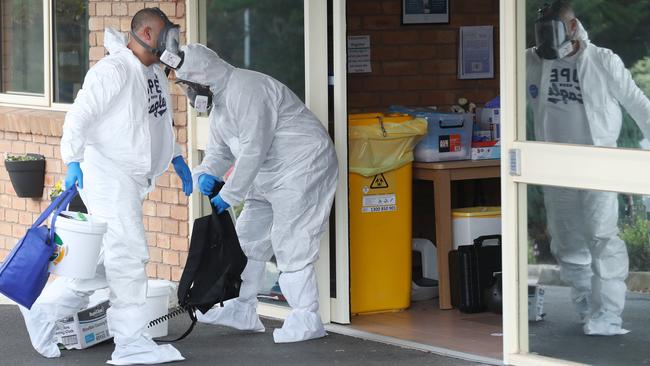 Cleaners are seen entering an Estia Health aged care facility. Picture: David Crosling