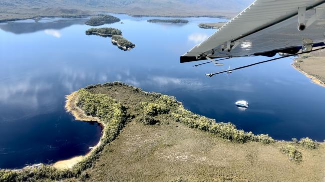 A sea plane circles ready to land next to the Odalisque III. Port Davey cruise, Tasmania. Picture: Philip Young