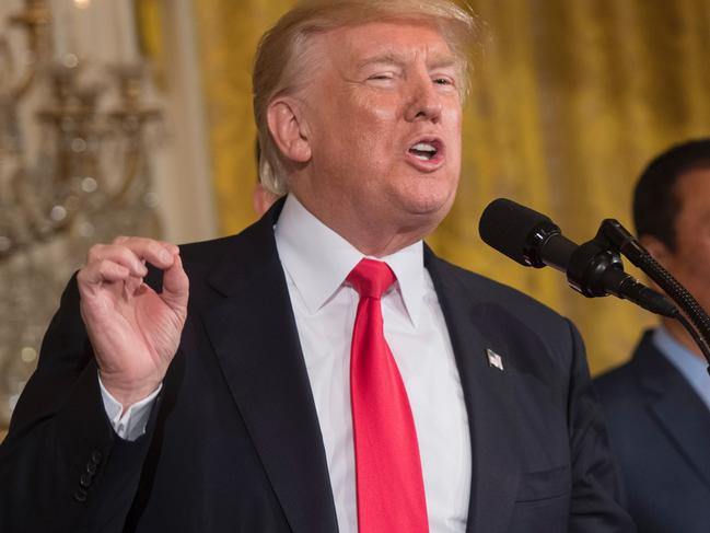 US President Donald Trump speaks alongside Terry Gou (R), Chairman of Foxconn, an electronics supplier, during an announcement that the company will open a manufacturing facility in Wisconsin, during an event in the East Room of the White House in Washington, DC, July 26, 2017. / AFP PHOTO / SAUL LOEB