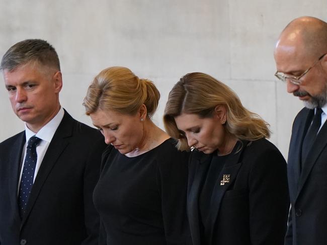 Olena Zelenska (second right) bows her head as she views the coffin of the Queen at Westminster Hall in London. Picture: Getty Images.