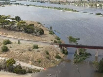 Water completely engulfing dairy flats next to the river in Murray Bridge.