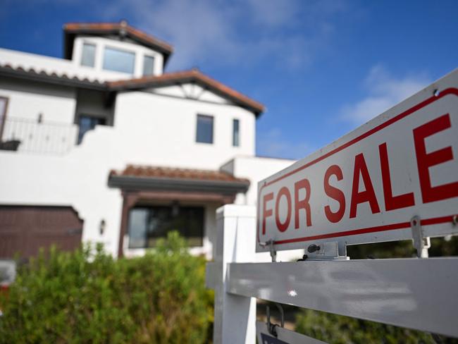 (FILES) A for sale sign is displayed outside of a home for sale on August 16, 2024 in Los Angeles, California. Sales of previously owned homes in the United States edged up in July, industry data showed on August 22, 2024, breaking a four-month trend of declines. (Photo by Patrick T. Fallon / AFP)