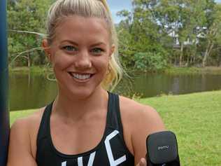 Brooke Hindmarsh with the PaMu Slide earbuds. Picture: Grant Edwards