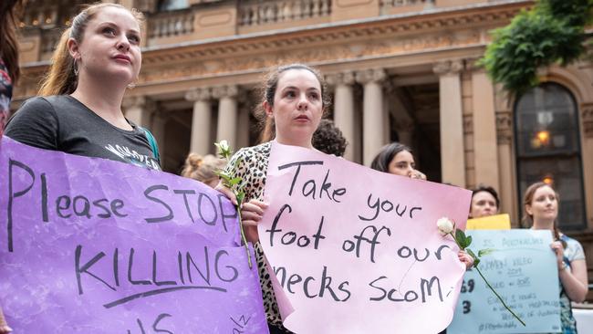 Alison Muir (left) and Melissa Dooley use the vigil to send a message. Picture: Flavio Brancaleone