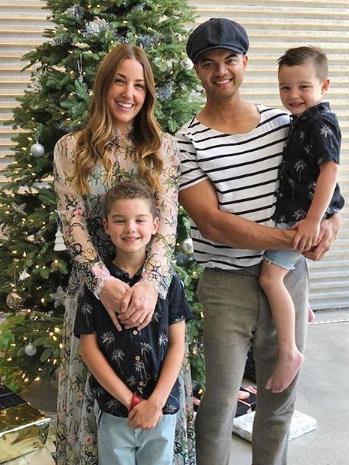 At home with his wife Jules and sons Hudson (left) and Archer at Christmas last year.