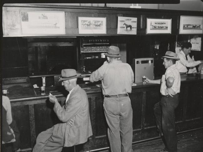 1954: The front bar at the Tallangatta Hotel, like all pubs in Victoria, was a male-only affair. Picture: State Library of Victoria