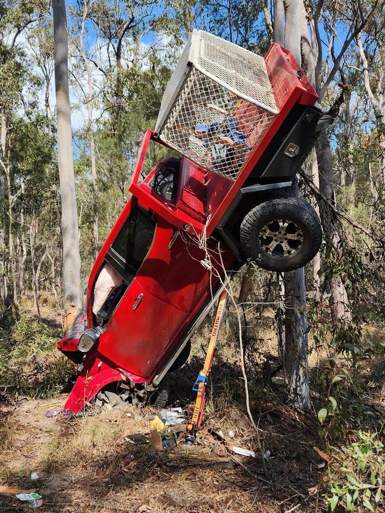 A 55-year-old man was the passenger in this ute which was left hanging in trees after a dramatic crash north of Gympie. Picture: Clayton's Towing