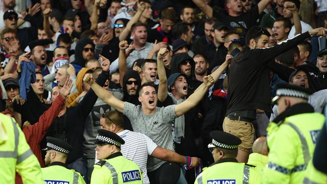 Hajduk Split supporters are held back by police and stewards.