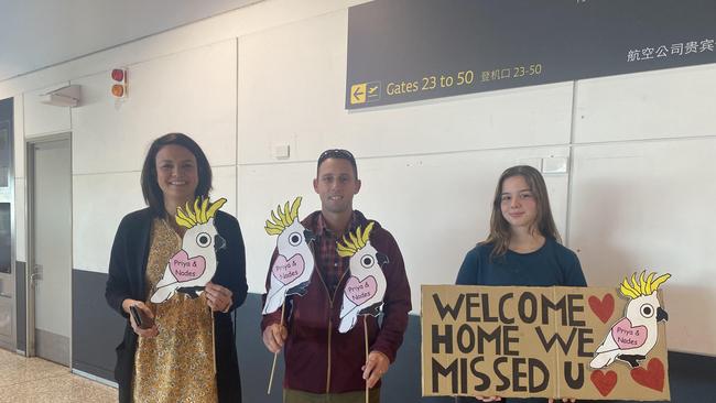 Three wellwishers who know the family came to Brisbane Airport to show their support. Picture: Finn Morton