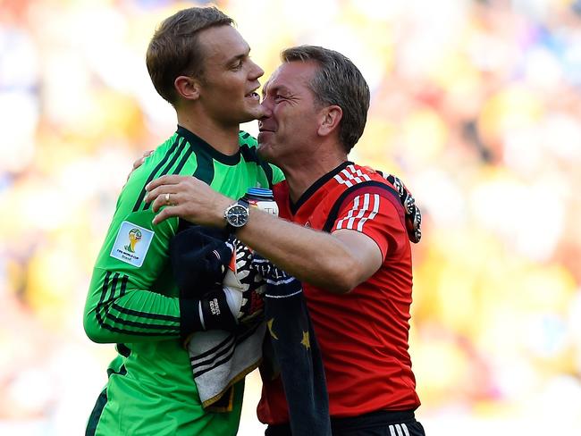 Germany's goalkeeper Manuel Neuer (L) celebrates with the German team's goalkeeper's coach Andreas Kopke after winning the quarter-final football match between France and Germany 1-0 at the Maracana Stadium in Rio de Janeiro during the 2014 FIFA World Cup on July 4, 2014. AFP PHOTO / FRANCK FIFE