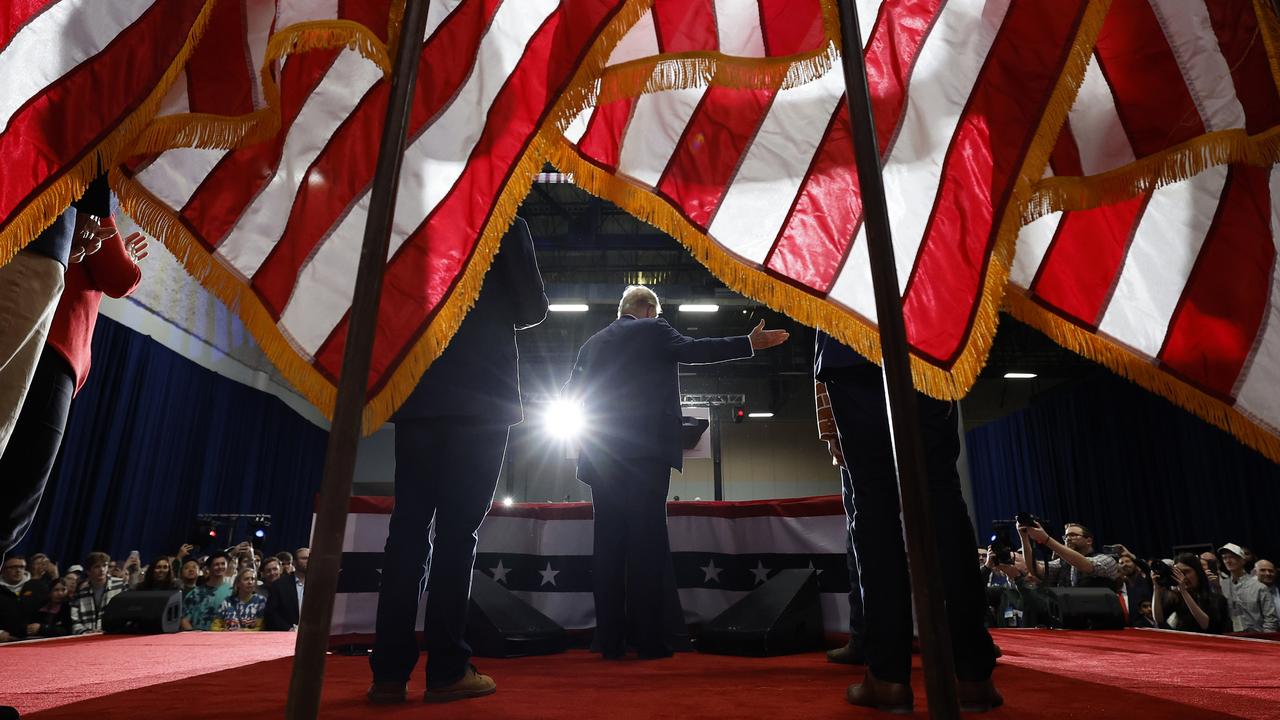 Former President Donald Trump, flanked by sons Eric and Donald Jr., speaks at the Iowa Events Center after winning the state’s caucus. Picture: Chip Somodevilla/Getty Images