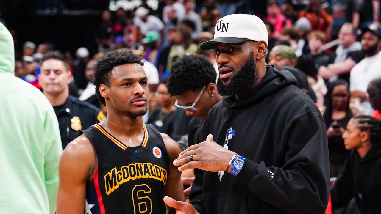 HOUSTON, TEXAS - MARCH 28: Bronny James #6 of the West team talks to Lebron James of the Los Angeles Lakers after the 2023 McDonald's High School Boys All-American Game at Toyota Center on March 28, 2023 in Houston, Texas. (Photo by Alex Bierens de Haan/Getty Images)