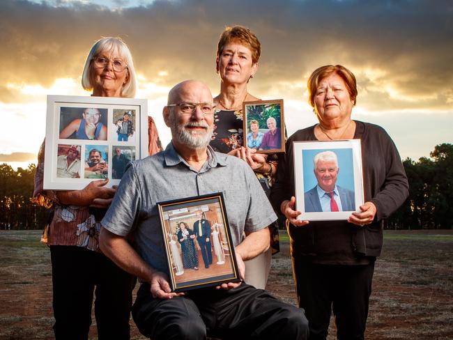 Sandi Todd, with photographs of her husband Mal; Stephen Lavender with a picture of his wife Linda; Veronica Leaney with a picture of her husband Roger and Elisabetta Ferraro, and her husband Frank. The spouses all died from Covid-19 in the Royal Adelaide Hospital's Intensive Care Unit in April last year. Picture Matt Turner.