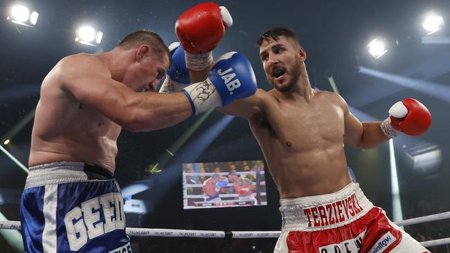 Kris Terzievski in action against Paul Gallen.