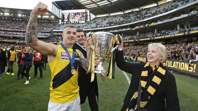 Dustin Martin with Richmond CEO Brendon Gale and president Peggy O