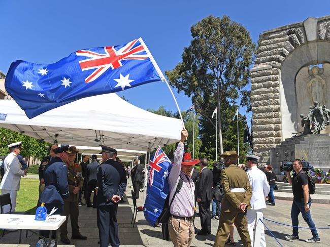 A small group of people for the Remembrance Day ceremony at the War Memorial North Tce. Picture: Tom Huntley