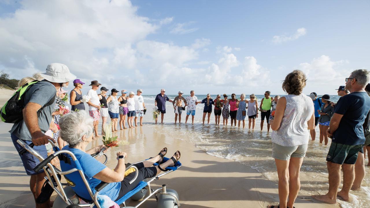 Bribie Island locals gather to pay tribute to 17 year old local Charlie Zmuda who was killed in a shark attack at Woorim Beach on Monday afternoon. Picture: Lachie Millard