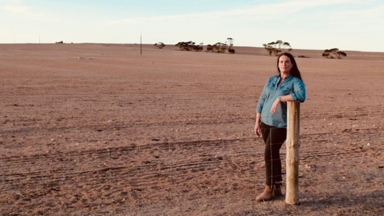 Farmer Suzie Kenny in one of her farm’s barren paddocks. Photo: Supplied