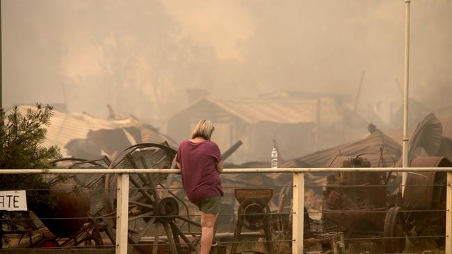 Diane Cross outside her destroyed home and business in the town of Tingha in northern NSW. Picture: Nathan Edwards