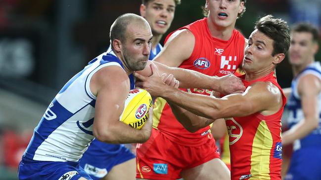 North Melbourne’s Ben Cunnington shrugs off a tackle. Picture: Getty Images