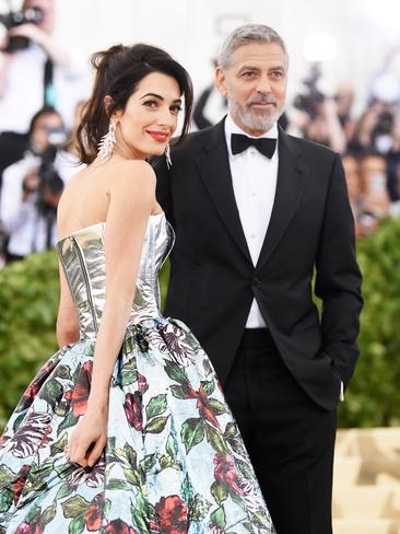 Met Gala co-host Amal Clooney and George Clooney arrive on the red carpet. Picture: Getty
