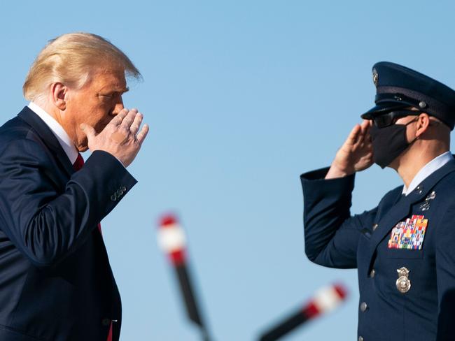 Donald Trump called presidential rival Joe Biden ‘corrupt’ during his campaign rally in Iowa, after a New York Post report was censored by Twitter and Faceook. Picture: AFP