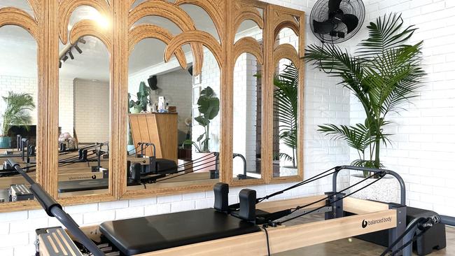 The statement palm tree mirrors that transport you out of a Pilates studio and onto a South American beach. Picture: Micaela Stark