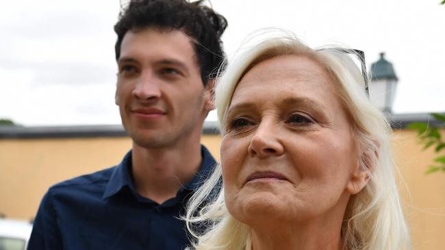 French far-right National Rally (RN) party member and candidate for the second round of legislative elections Marie-Caroline Le Pen (R) looks on with political campaign leaflets and her deputy Noa Lerosier in Brains-Sur-GÃ©e, western France, on July 4, 2024.  (Photo by JEAN-FRANCOIS MONIER / AFP)