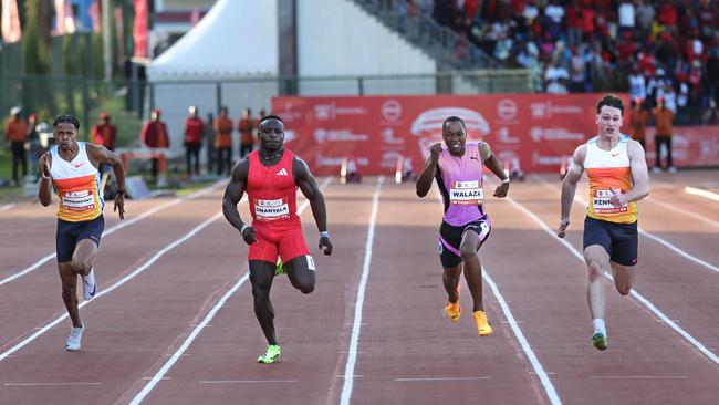 Australia's Lachlan Kennedy (R) charges to the finish line ahead of South Africa's Bayanda Walaza (2R) and Kenya's Ferdinand Omanyala (2L). Picture: Tony Karumba / AFP.