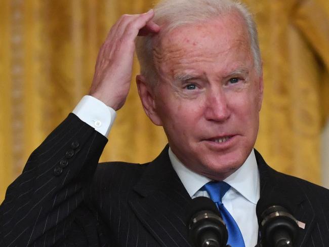 US President Joe Biden speaks about efforts to address global transportation supply chain bottlenecks, in the East Room of the White House in Washington, DC, on October 13, 2021. (Photo by Nicholas Kamm / AFP)