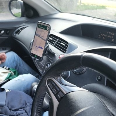 A driver was nabbed for using a phone cradle while driving. Picture: NSW Police