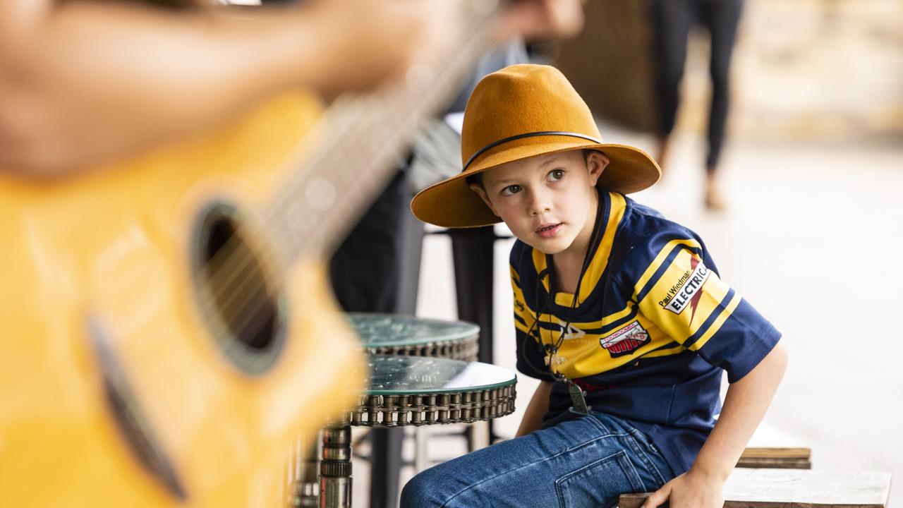 Six-year-old Charlie Bell watches Vanessa Miller perform as part of the Toowoomba Busking Festival, Saturday, April 30, 2022. Picture: Kevin Farmer