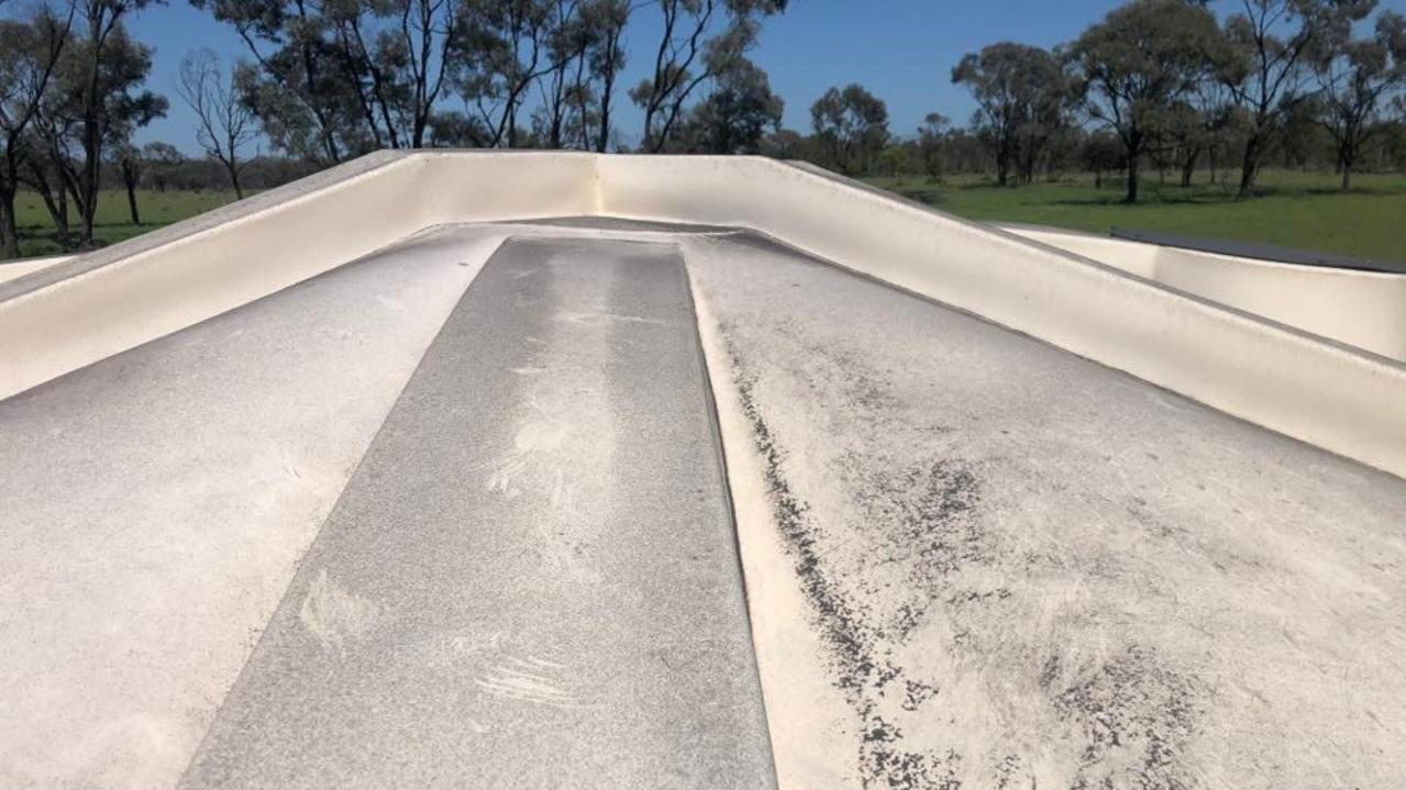 Coal dust sediment in cattle troughs on Bill Wyper’s property in Collinsville.