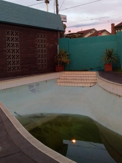 The motel’s neglected pool.