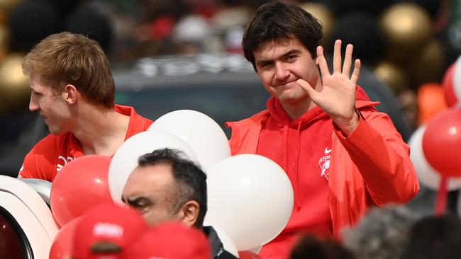 Logan McDonald waves to fans during the AFL Grand Final parade.