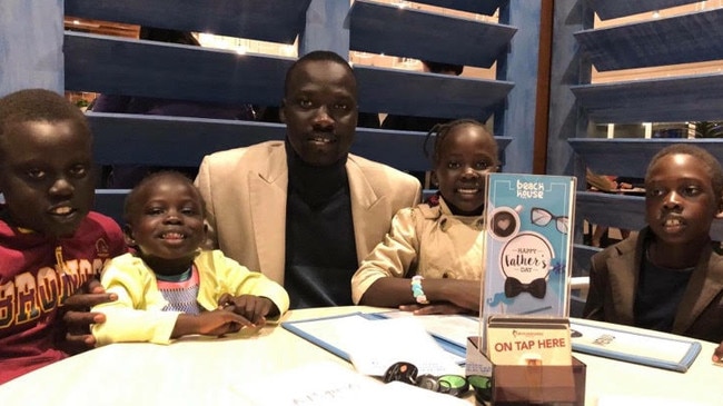 Queensland's Local Hero for 2019 Elijah Buol, 33, with his family. Photographer: Liam Kidston.